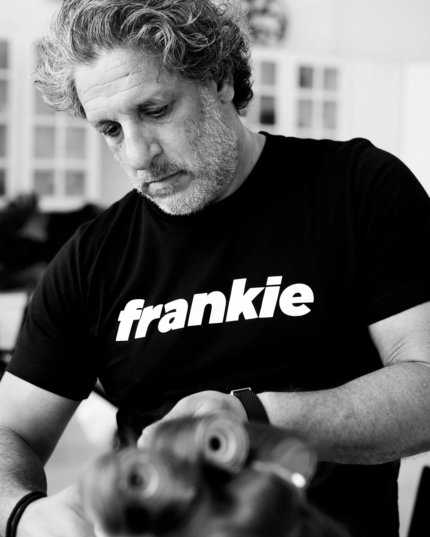 Black and white photograph of the Frankie team at work